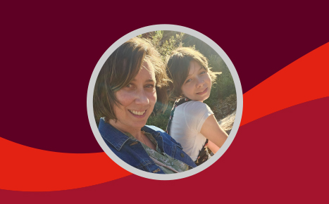 image of a lady and her young daughter smiling at the camera