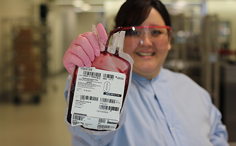 Woman holding bag of blood
