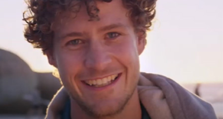 a man smiling at the camera