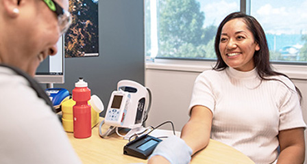 a woman having her blood pressure taken