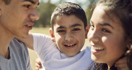 a family of three outdoors