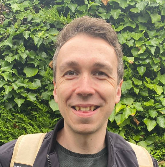 Ben smiling facing the camera