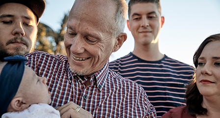 a family gathered together and smiling