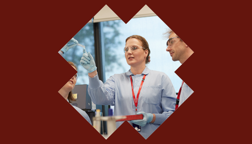 researcher looking at blood sample 