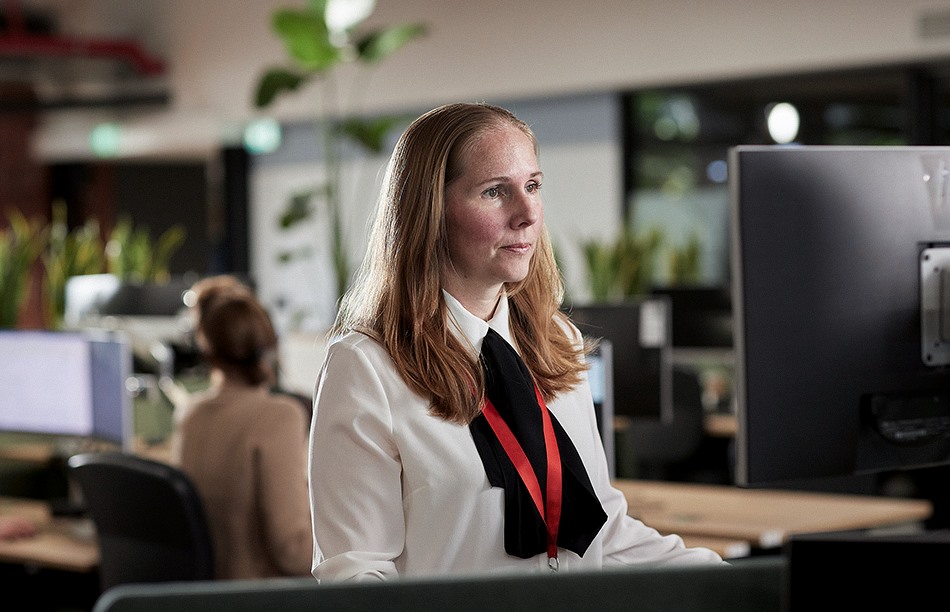 a woman seated at a desk in an office