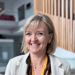 Daniela smiling at the camera