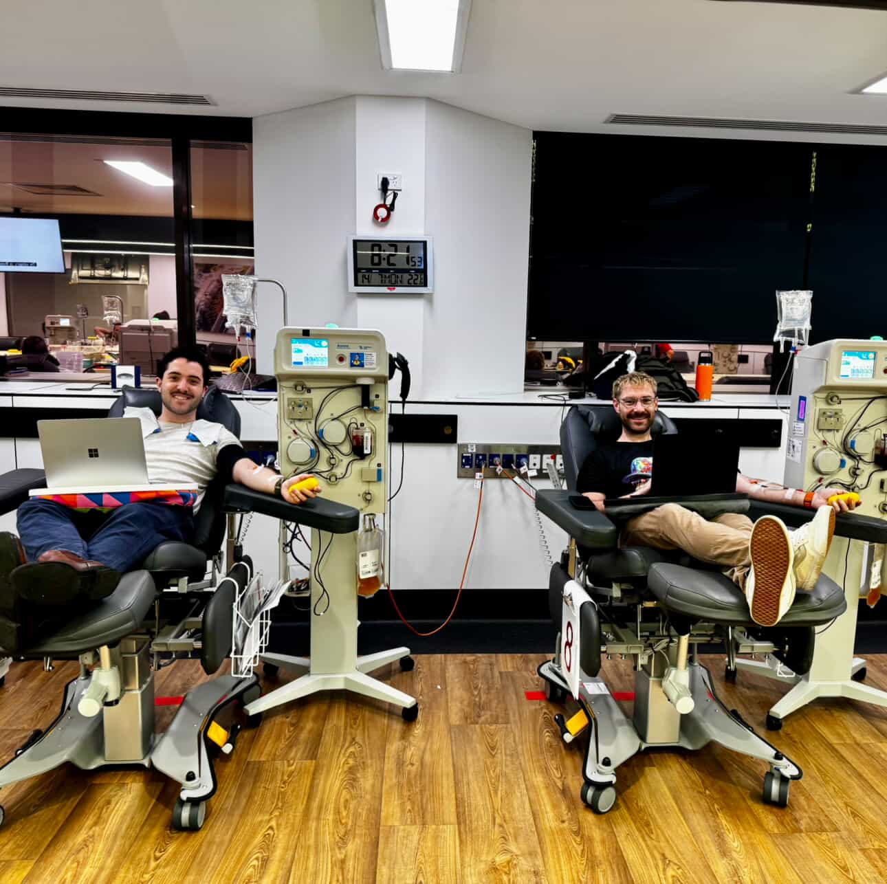 Two men donating plasma 