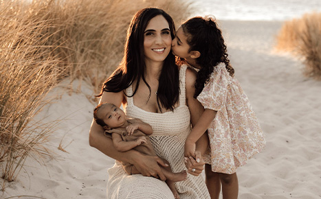 image of a mother with her infant son and toddler daughter