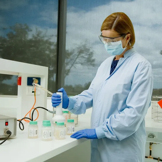 a scientist in a lab working with samples