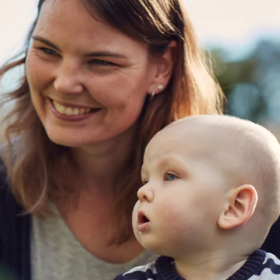 a woman and a baby smiling