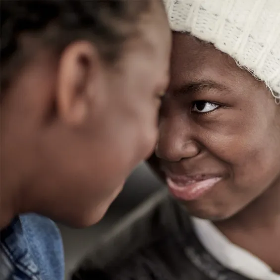 image of girl smiling touching foreheads with a male