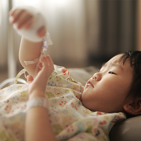 image young child with IV tube in arm