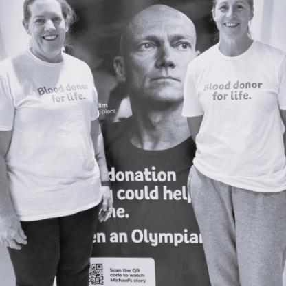two woman standing in front of Lifeblood sign