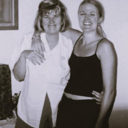 A photo of a mum and daughter smiling