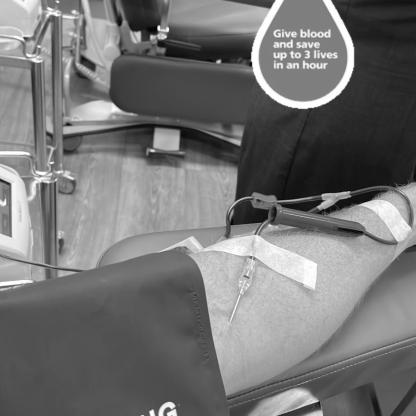 person donating showing the neelde in their arm