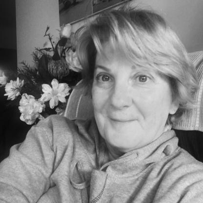 woman taking a selfie smiling to camera