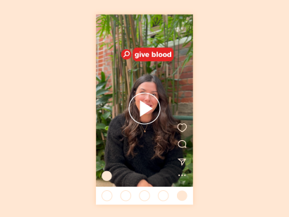 image of a female smiling to the camera with a play button overlayed