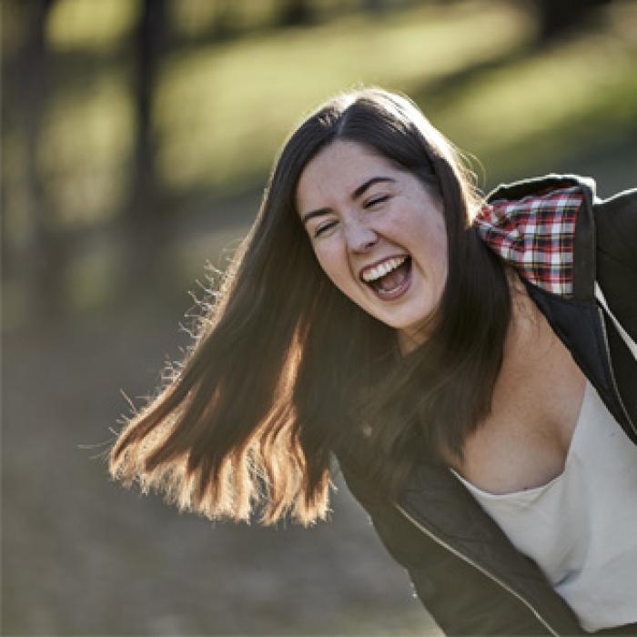 image of a woman laughing