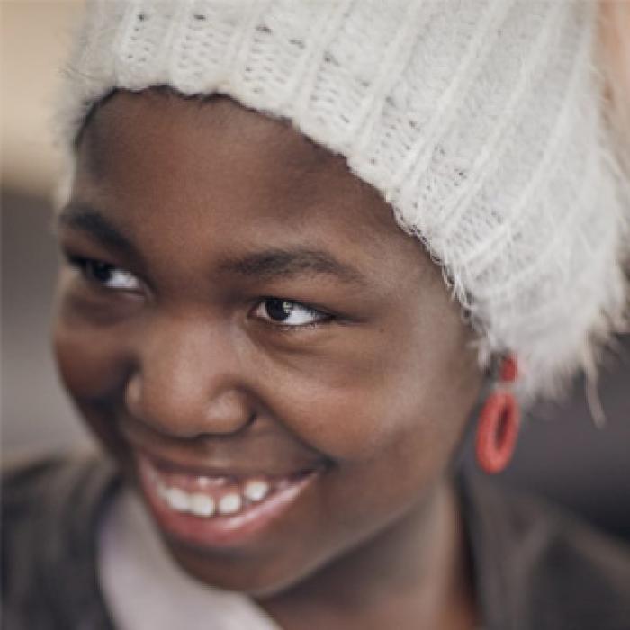 Close up of Mapolo recipient wearing a white hat